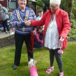 Lily Belle, winner "Waggiest Tail", being given her prize by Cllr Anita Ashcroft